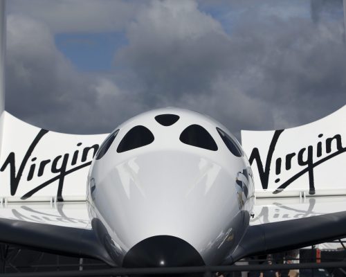 The Virgin Galactic SpaceShipTwo stands outside the company's stand on the third day of the Farnborough International Air Show in Farnborough, U.K., on Wednesday, July 11, 2012. The Farnborough International Air Show runs from July 9-15. Photographer: Chris Ratcliffe/Bloomberg