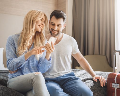 Young man and woman together tourism hotel using digital device