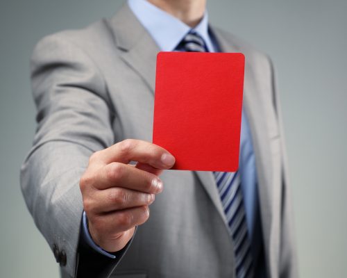 Showing the red card concept for bad business practice, exclusion or criminal activity